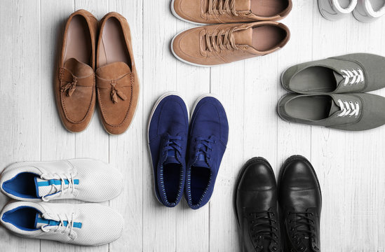 Different male shoes on light background