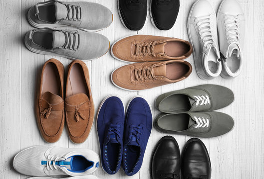 Different male shoes on light background