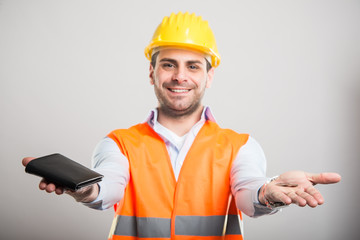 Selective focus of handsome architect holding key and wallet