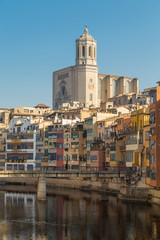 Fototapeta na wymiar Girona postcard view from viewpoint at the Princess Brindge or Pont d'en Gomez and the river Onyar