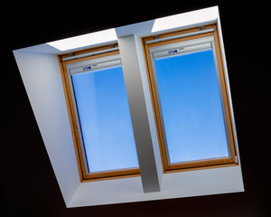 double roof windows overlooking the blue sky