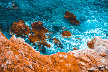 beautiful cliff scene with cold colored water