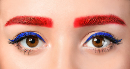 Obraz premium Young woman with dyed eyebrows, closeup
