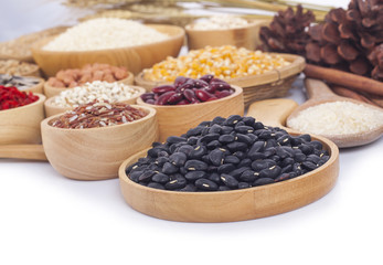Cereal grains , seeds, beans on wooden background