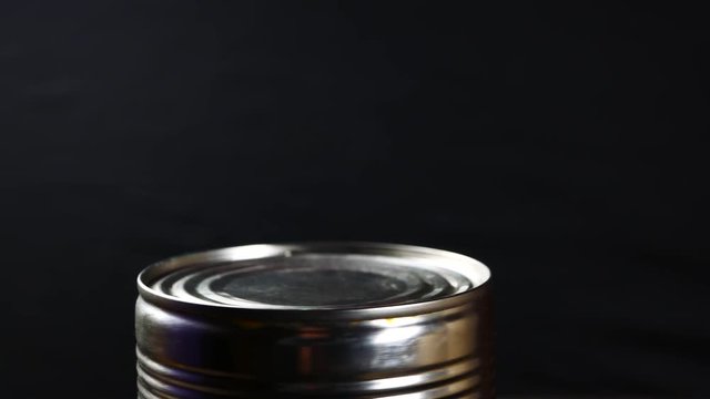 Aluminum tin can on a black background