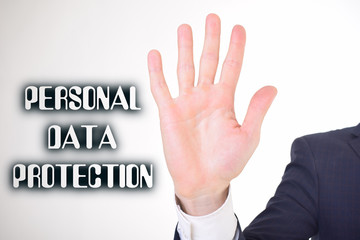 A businessman shows an inscription:PERSONAL DATA PROTECTION