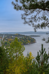 Obraz premium Cityscape of oslo village among autmn trees on an island in Oslo Fjord