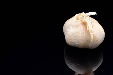 Garlic on a black background.