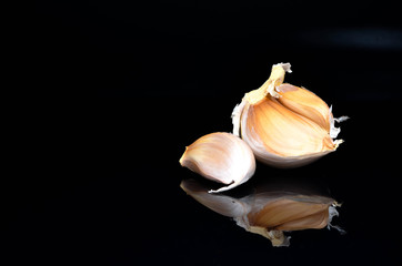 Garlic on a black background.