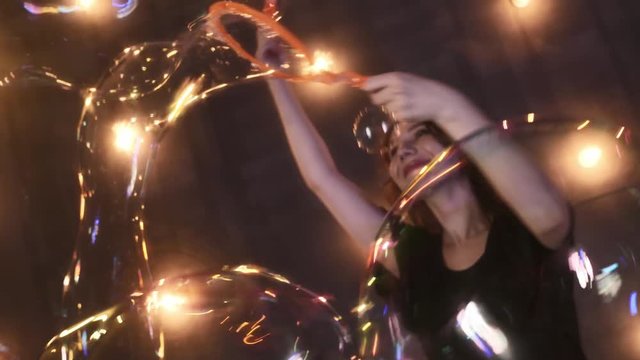 young girl performer in soap bubbles magician show