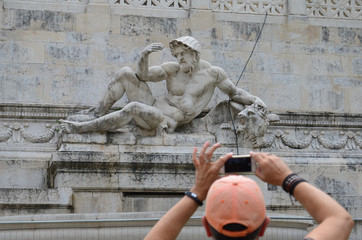 Tourist Taking Picture Poseidon Sculpture