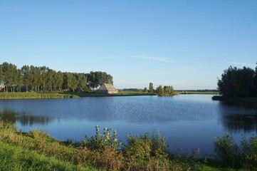 Farmland view in Netherlands near Oostburg, twilight time of sunset
