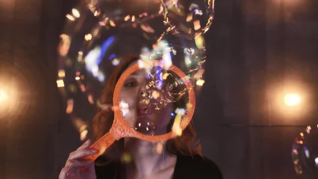 young girl performer in soap bubbles magician show