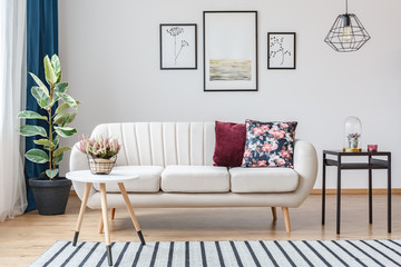 Beige sofa with wooden legs