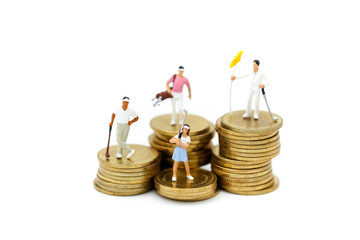 Miniature people : Golfer teams playing stand with stack of coins , sport and business concept.