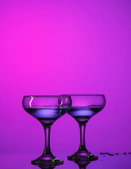 Two wine glasses standing on the table at studio
