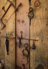 Vintage wood working carpentry tools hanging on wood wall.