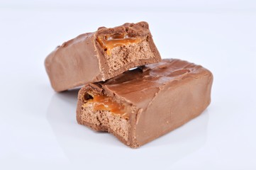 Closeup of chocolate bar on white background. Selective focus.