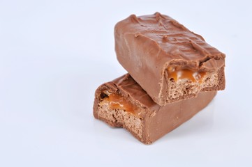 Closeup of chocolate bar on white background. Selective focus.
