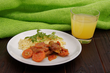 Tempeh with carrot and bulgur on a table