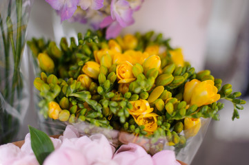 Macrophotography of tender spring yellow flowers in a flower shop