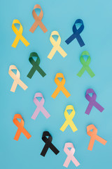 flat lay with arranged colorful ribbons isolated on blue, world health day concept