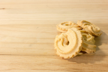Closeup stack of cookies on wooden background.