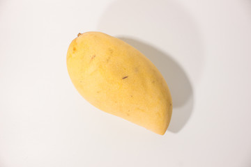 Ripe mango on white background.