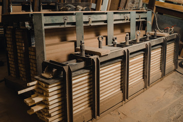 Wooden beam in the press for gluing for the production of doors