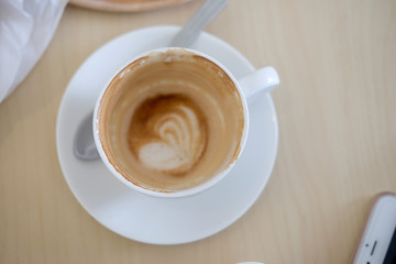 Empty coffee cup after drink on wood table