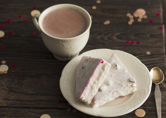  photo of cacao with cake on a saucer on a wooden table
