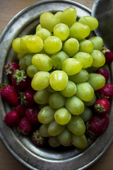 fresh, green, ripe grapes and fragrant strawberries