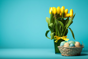 Yellow tulips on blue background