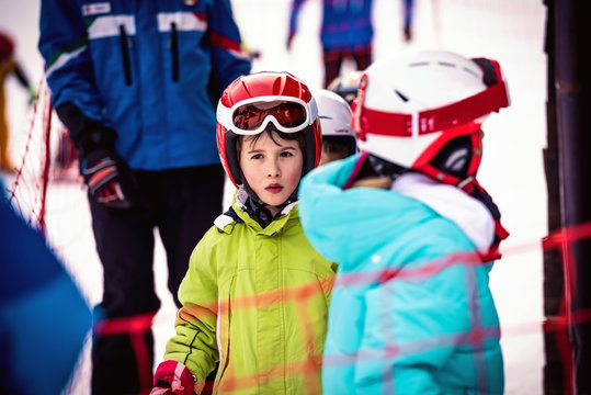 Little boy who take skiing lessons
