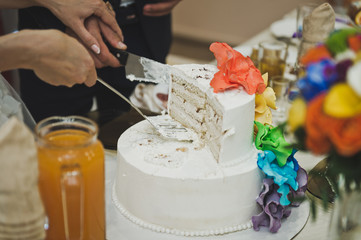 Cake decorated with flowers of all colors of the rainbow 706.