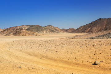 Fototapeta na wymiar Road through the african desert of Egypt