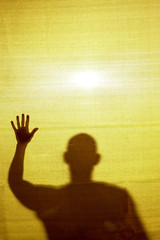 Abstract / surreal image of a man trapped behind a fabric.