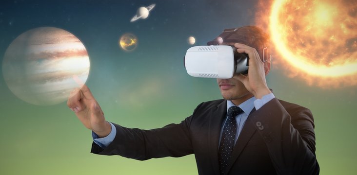 Composite image of businessman gesturing while using vr glasses