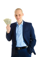 Happy handsome man in a suit holding fan of dollar banknotes, businessman and money. Isolated on white background.