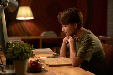 Female student reading book