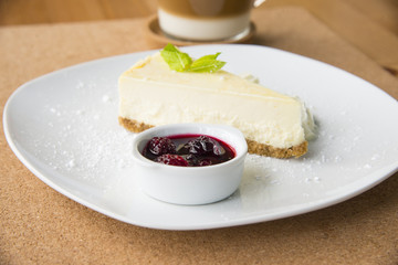 Cheese cake with berries and coffee