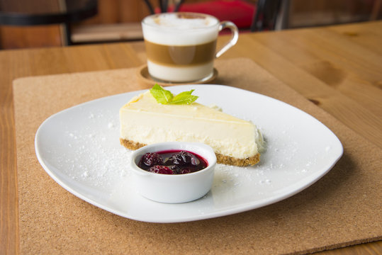 Cheese cake with berries and coffee
