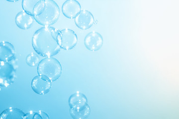 Abstract background. soap bubbles floating on blue background.