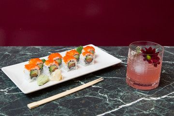 Tray of maki sushi with avocado, salmon and caviar