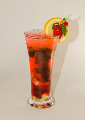 red alcoholic drink with ice on white background