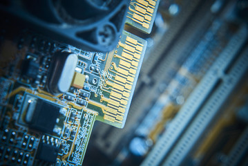 Close up of installing a Graphics Card on the computer motherboard. Selective focus