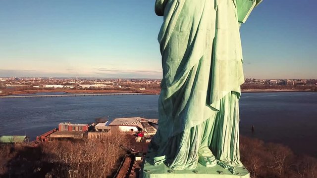 Statue of Liberty rising aerial of front of famous symbol of freedom in America in 4K and 1080 HD