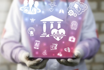 Surgeon offers tablet computer with donor donation fund icon on a virtual interface. Donors organ...