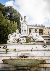 Fountain and pincian hill in piazza del popolo Rome Italy