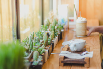 Beautiful woman taking a coffee picture in a cafe alone.